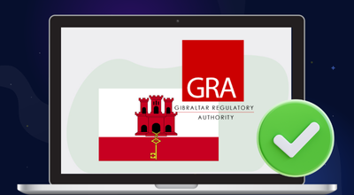 Laptop showing GGC logo and green approval icon next to it.