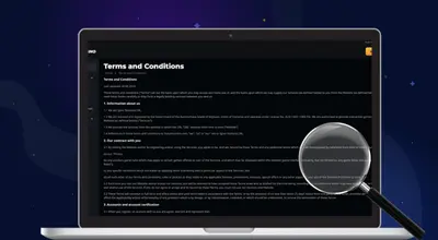 A laptop displays the website's Terms and Conditions on a dark background with a magnifying glass.