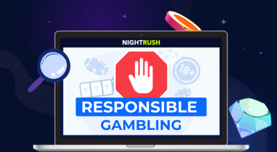 A laptop with a responsible gambling warning and casino items around it against a dark background.