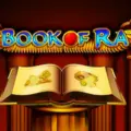 Book of Ra logo displaying an open ancient book illuminated on a pedestal.
