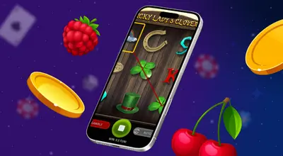 A smartphone displays the Lucky Lady's Clover slot game interface with a winning clover symbol line.