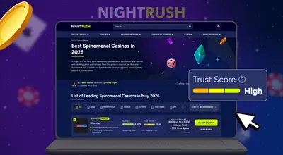 Laptop showing a casino footer with licensing information and regulatory logos.