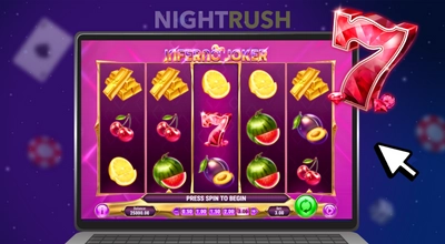 Laptop screen displaying Inferno Joker slot reels with a large crystal 7 symbol and a cursor.