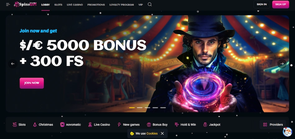 SpinsUP Casino's main page has a magician on a banner with bonus details against a black setting.