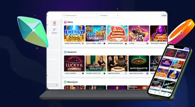 Laptop and smartphone showing various casino games.
