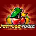Fortune Three slot with fruits glowing against a red background.