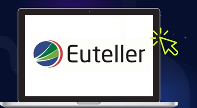 Euteller-logo kannettavalla tietokoneella, jossa on kursori tummalla taustalla.