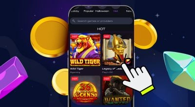Interface mobile affichant des jeux de casino en ligne, avec une main sélectionnant une machine à sous populaire, entourée de pièces et gemmes colorées.