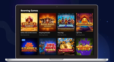 En laptop med spill fra Booming Games på Hugo Casino.